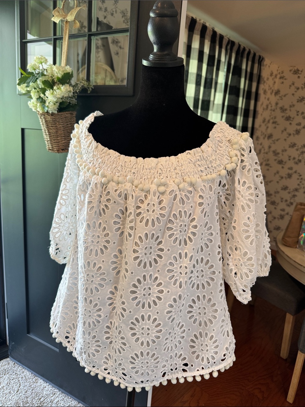 Lilly Pulitzer Raylee top with pinwheel eyelet embroidery and pom-pom trim